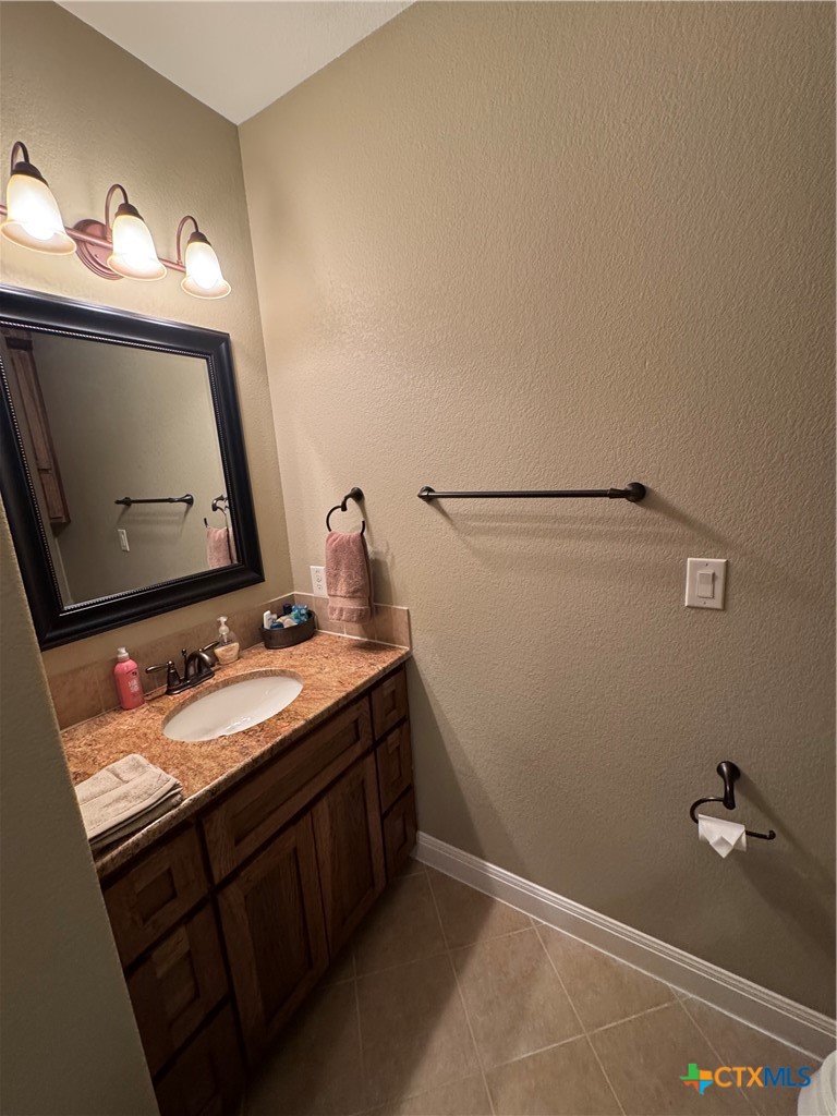 2306 Arroyo Grande Leander, TX 78641 - Photo 24 of 44 a bathroom with a sink and a mirror