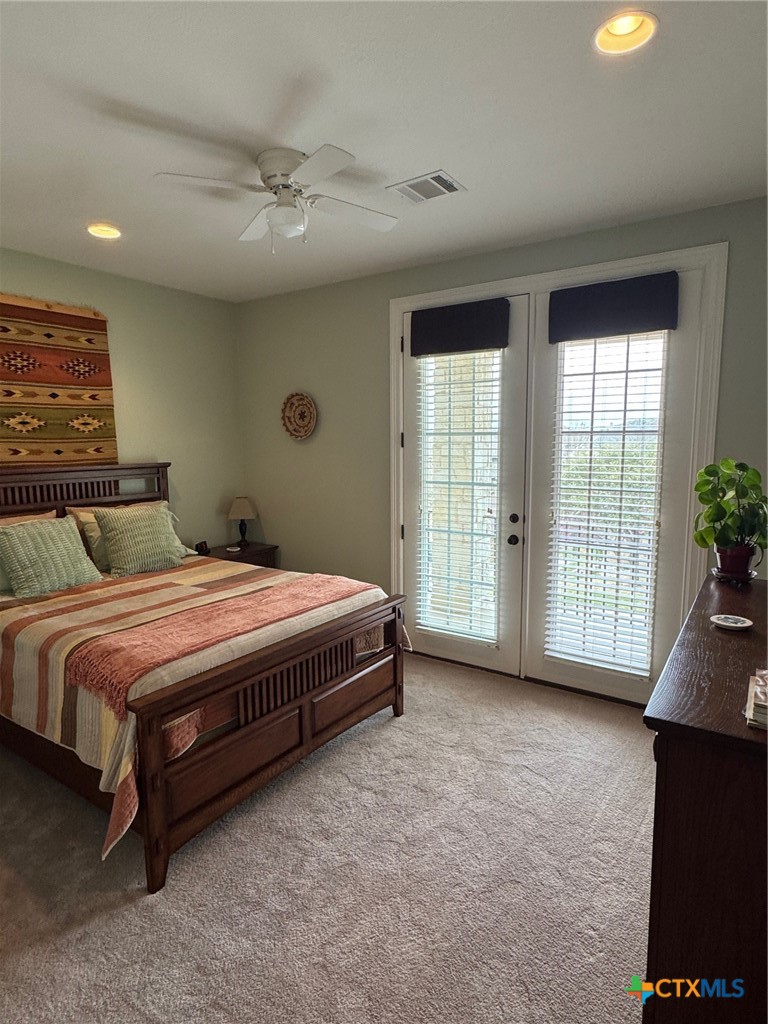 2306 Arroyo Grande Leander, TX 78641 - Photo 29 of 44 a spacious bedroom with a bed and a couch