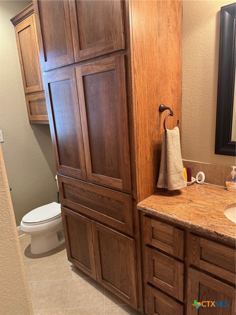 2306 Arroyo Grande Leander, TX 78641 - Photo 32 of 44 a bathroom with a sink and toilet