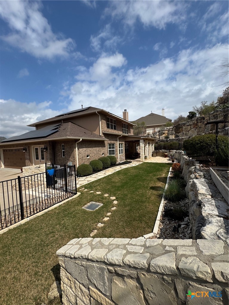2306 Arroyo Grande Leander, TX 78641 - Photo 41 of 44 a view of a house with backyard porch and sitting area