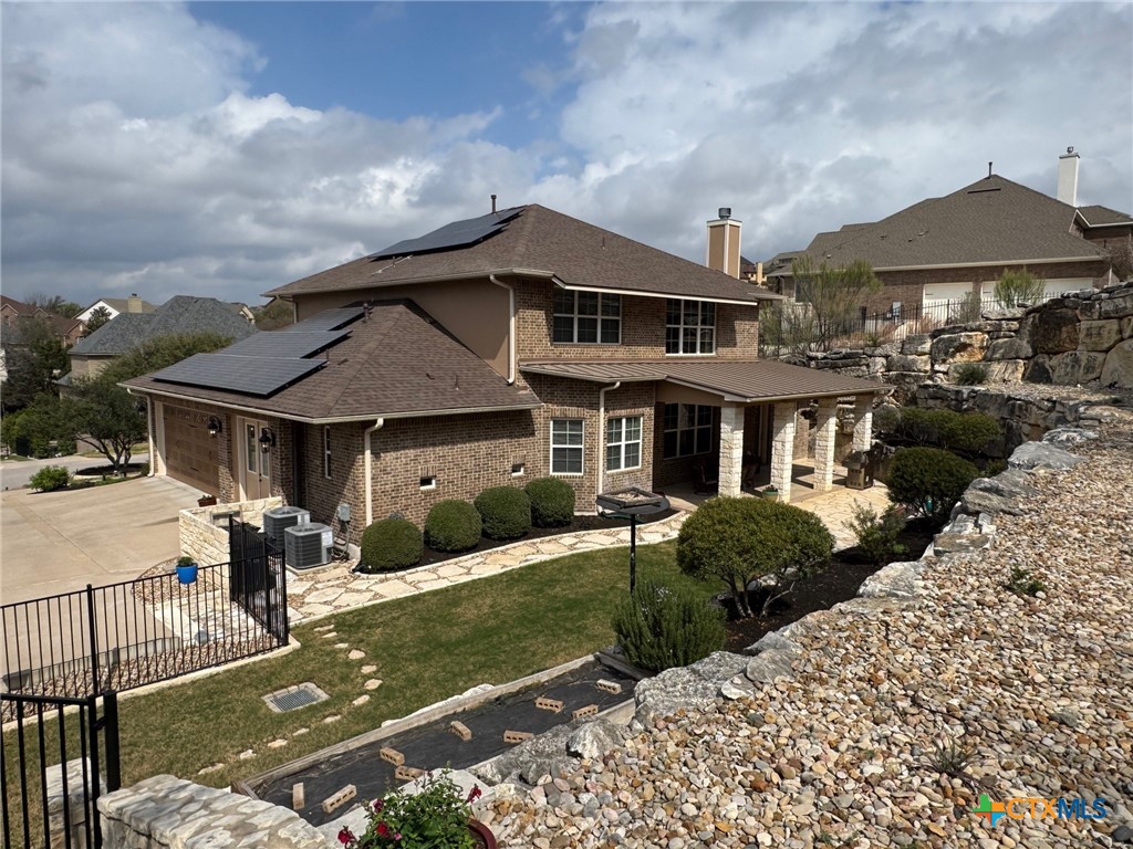 2306 Arroyo Grande Leander, TX 78641 - Photo 42 of 44 a front view of a house with garden