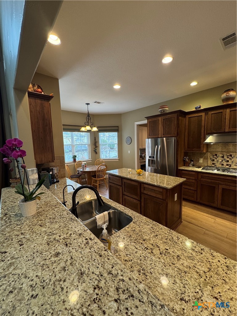 2306 Arroyo Grande Leander, TX 78641 - Photo 6 of 44 a kitchen with granite countertop lots of counter top space