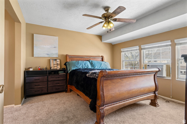 165 Pheasantbrook Drive Centerville, UT 84014 - Photo 12 of 30 Bedroom featuring light colored carpet, a textured ceiling, ceiling fan, and cooling unit