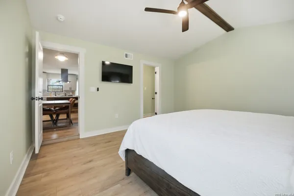 a room with a bed and furniture