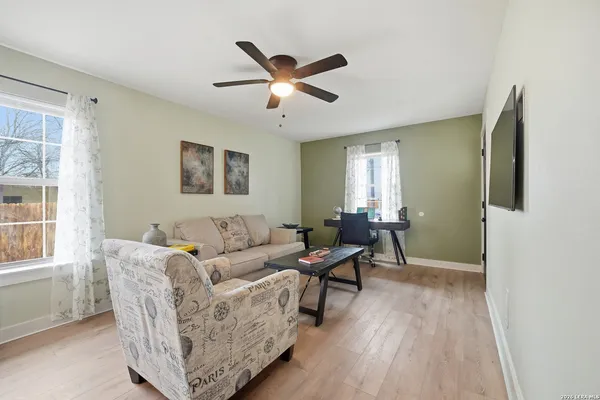 a living room with furniture and a window