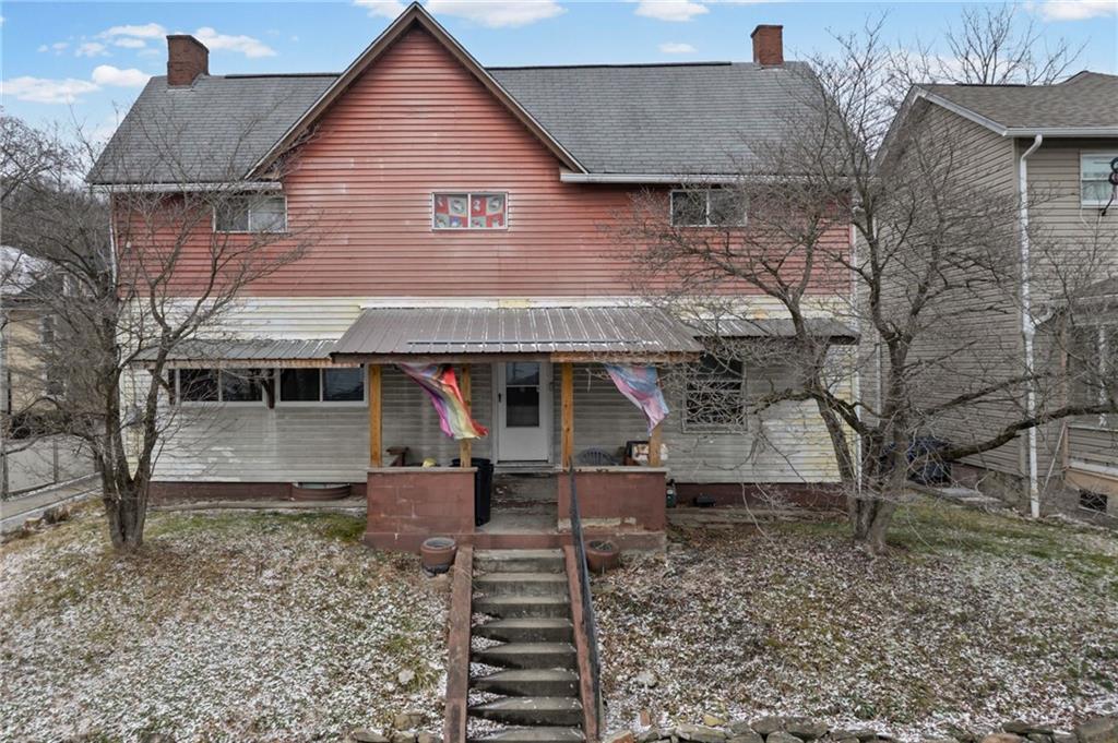 518 West Penn Street Butler, PA 16001 - Photo 1 of 14 a front view of a house with a yard