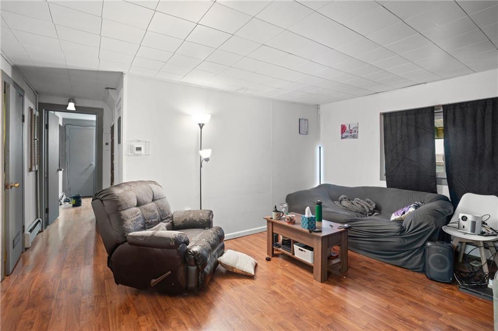 518 West Penn Street Butler, PA 16001 - Photo 2 of 14 a living room with furniture and wooden floor