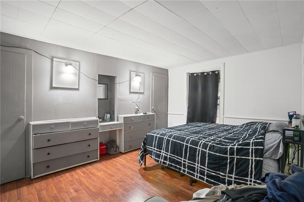 518 West Penn Street Butler, PA 16001 - Photo 6 of 14 a bedroom with a bed and a dresser