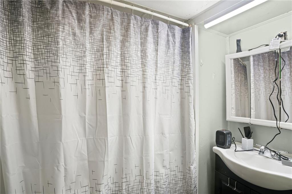518 West Penn Street Butler, PA 16001 - Photo 8 of 14 a bathroom with a sink and a mirror