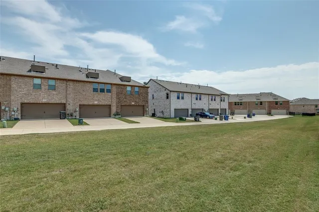 swimming pool view with a seating space and a garden view