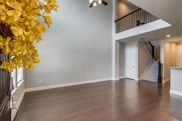 a view of an entryway with wooden floor