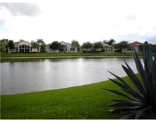 7738 Rinehart Drive Boynton Beach, FL 33437 - Photo 20 of 24 VIEW OF LAKE IN BACK OF HOUSE
