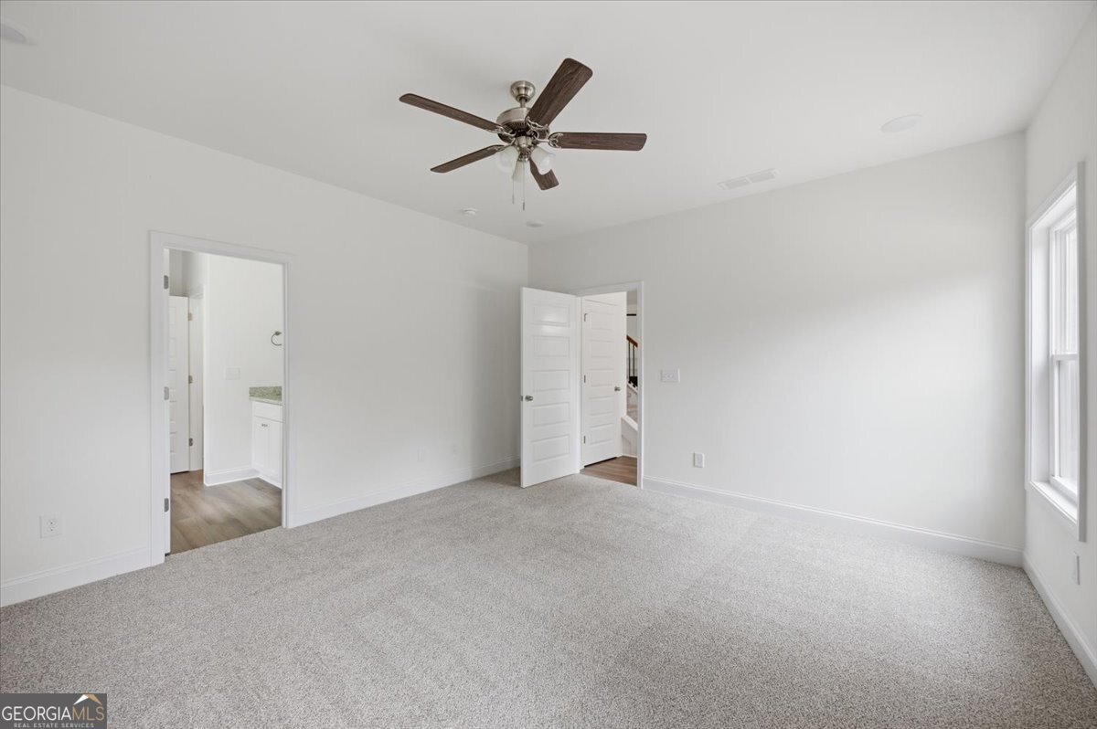 2778 Boxankle Road Forsyth, GA 31029 - Photo 13 of 21 an empty room with closet and ceiling fan