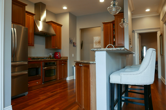 Undisclosed Address Chicago, IL 60607 - Photo 14 of 47 a kitchen with a refrigerator and a wooden cabinets