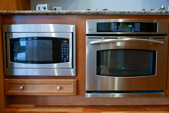 Undisclosed Address Chicago, IL 60607 - Photo 20 of 47 a stove top oven sitting inside of a kitchen