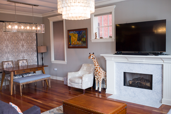Undisclosed Address Chicago, IL 60607 - Photo 23 of 47 a living room with furniture a flat screen tv and a fireplace