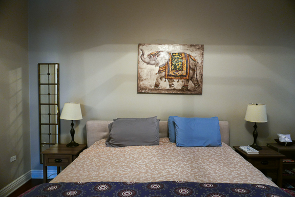 Undisclosed Address Chicago, IL 60607 - Photo 32 of 47 a bedroom with a bed and a lamp on table