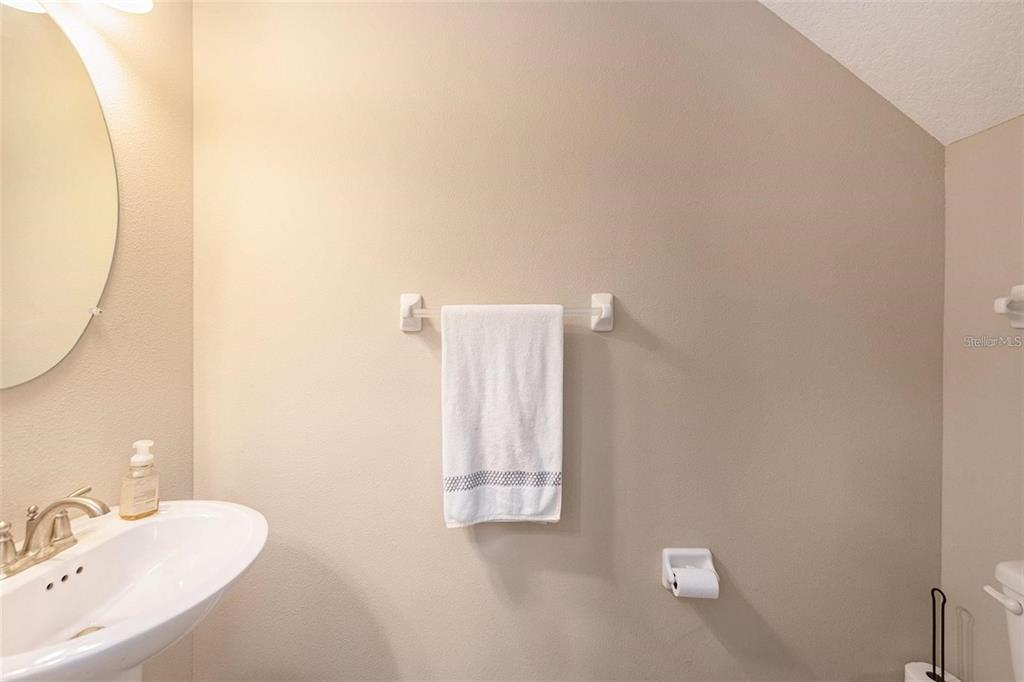 9152 Fox Sparrow Road Tampa, FL 33626 - Photo 14 of 32 a bathroom with a sink and a mirror