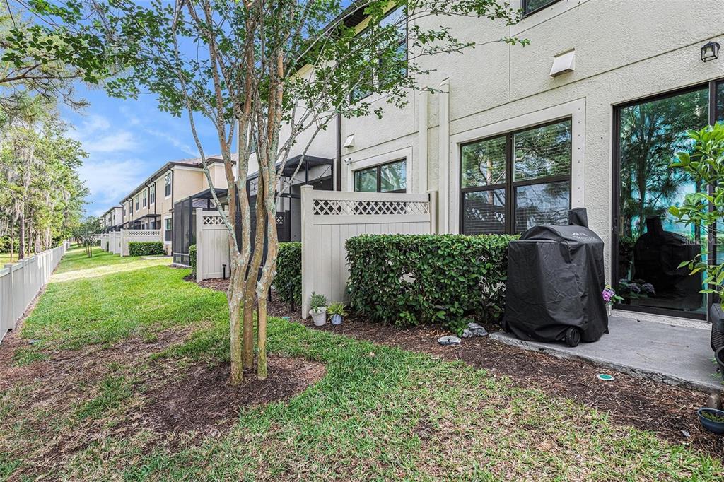 9152 Fox Sparrow Road Tampa, FL 33626 - Photo 22 of 32 a view of a garden with large trees