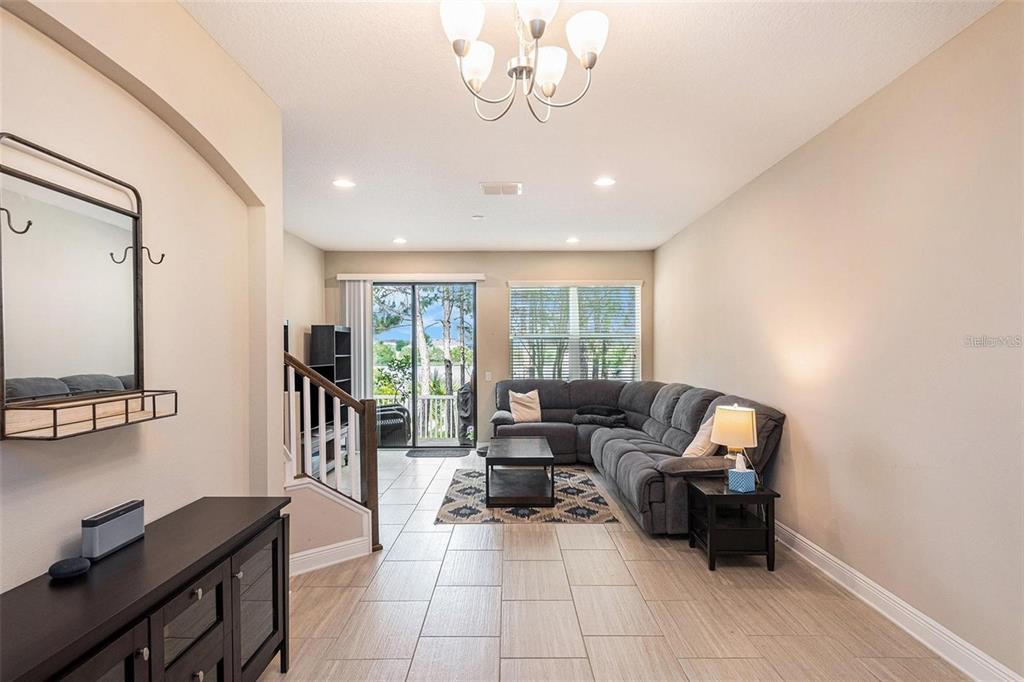 9152 Fox Sparrow Road Tampa, FL 33626 - Photo 8 of 32 a living room with furniture and a window