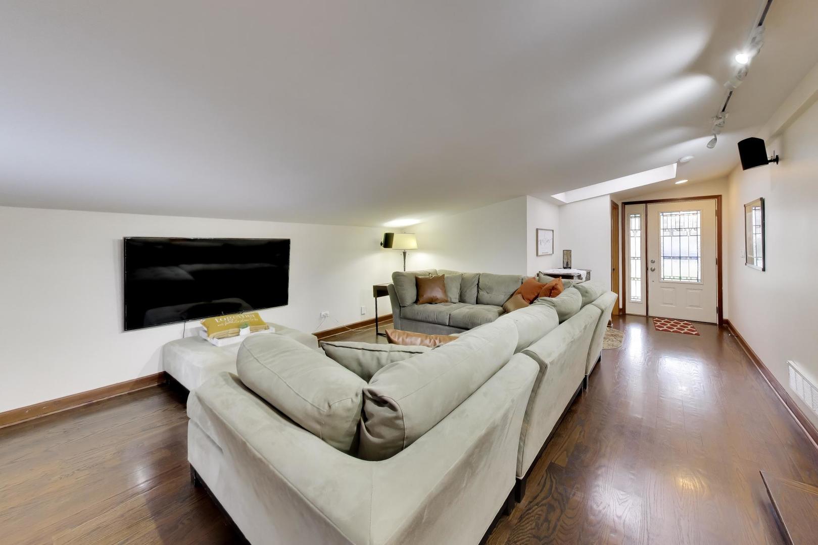 802 Lill Street Barrington, IL 60010 - Photo 16 of 27 a living room with furniture and a flat screen tv