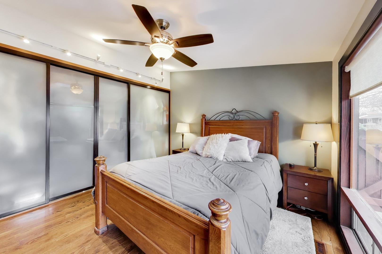 802 Lill Street Barrington, IL 60010 - Photo 18 of 27 a bedroom with a bed and a large mirror