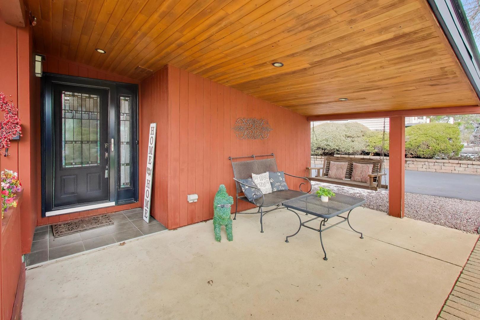 802 Lill Street Barrington, IL 60010 - Photo 2 of 27 a building outdoor space with patio furniture and potted plants