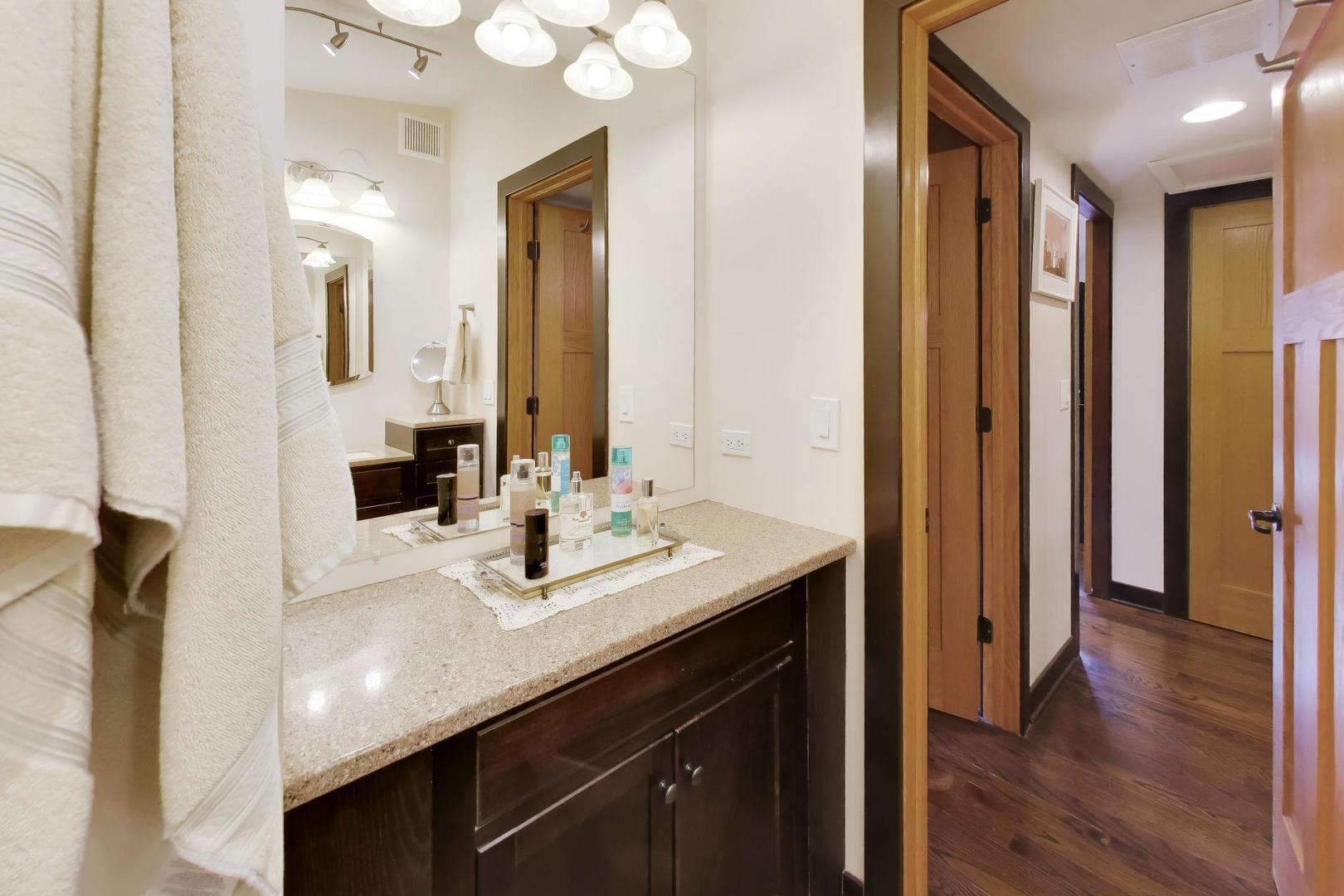802 Lill Street Barrington, IL 60010 - Photo 26 of 27 a en suite bathroom with a sink double vanity and a mirror