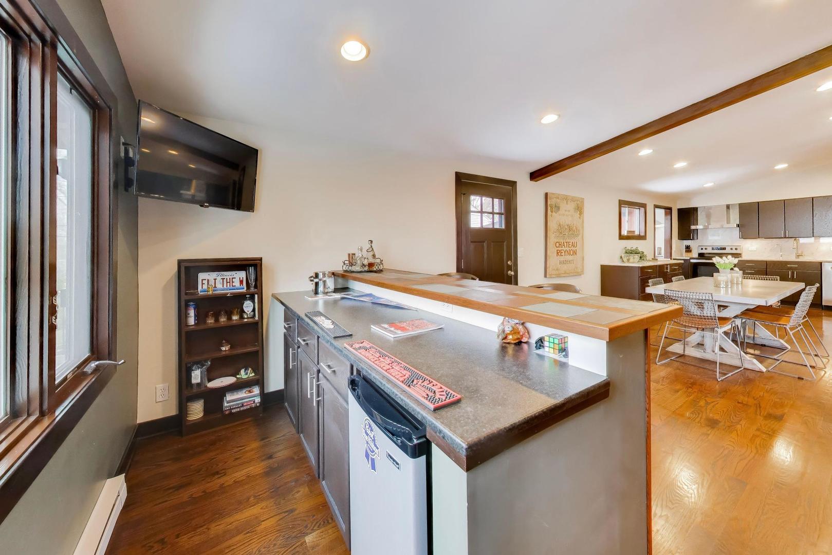 802 Lill Street Barrington, IL 60010 - Photo 8 of 27 a kitchen with stainless steel appliances granite countertop a sink and a refrigerator