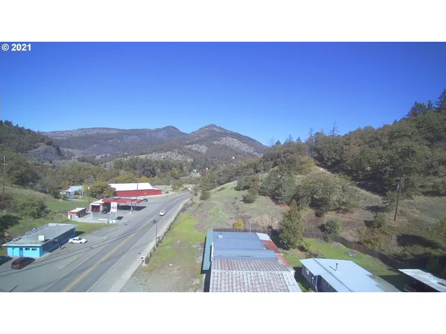 a aerial view of a house with a yard