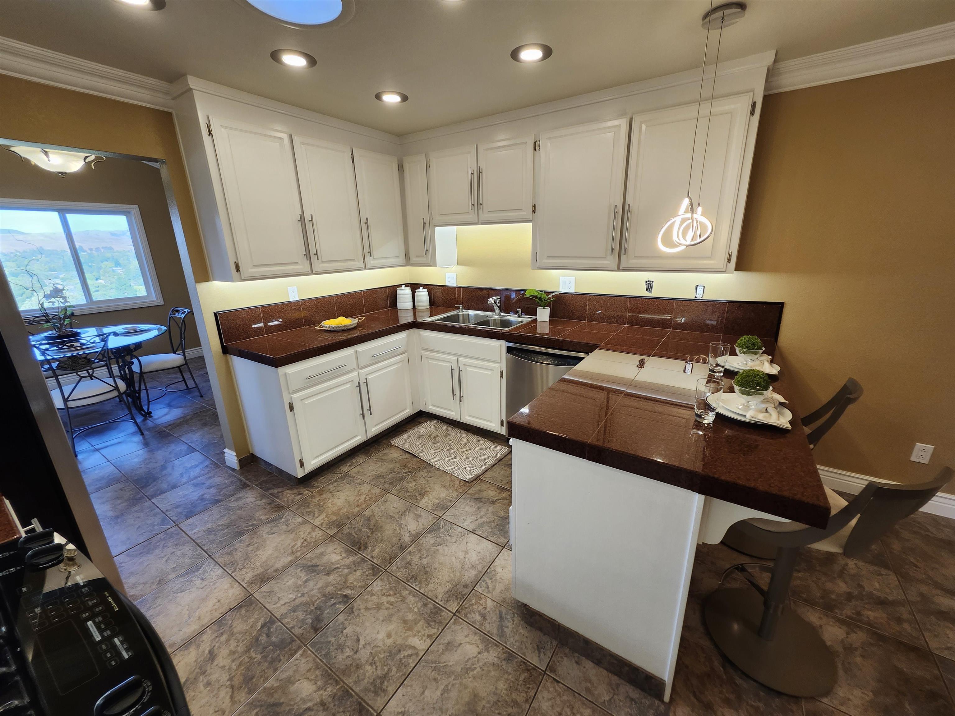1823 Mockingbird Place Danville, CA 94526 - Photo 11 of 60 a kitchen with a sink appliances and cabinets