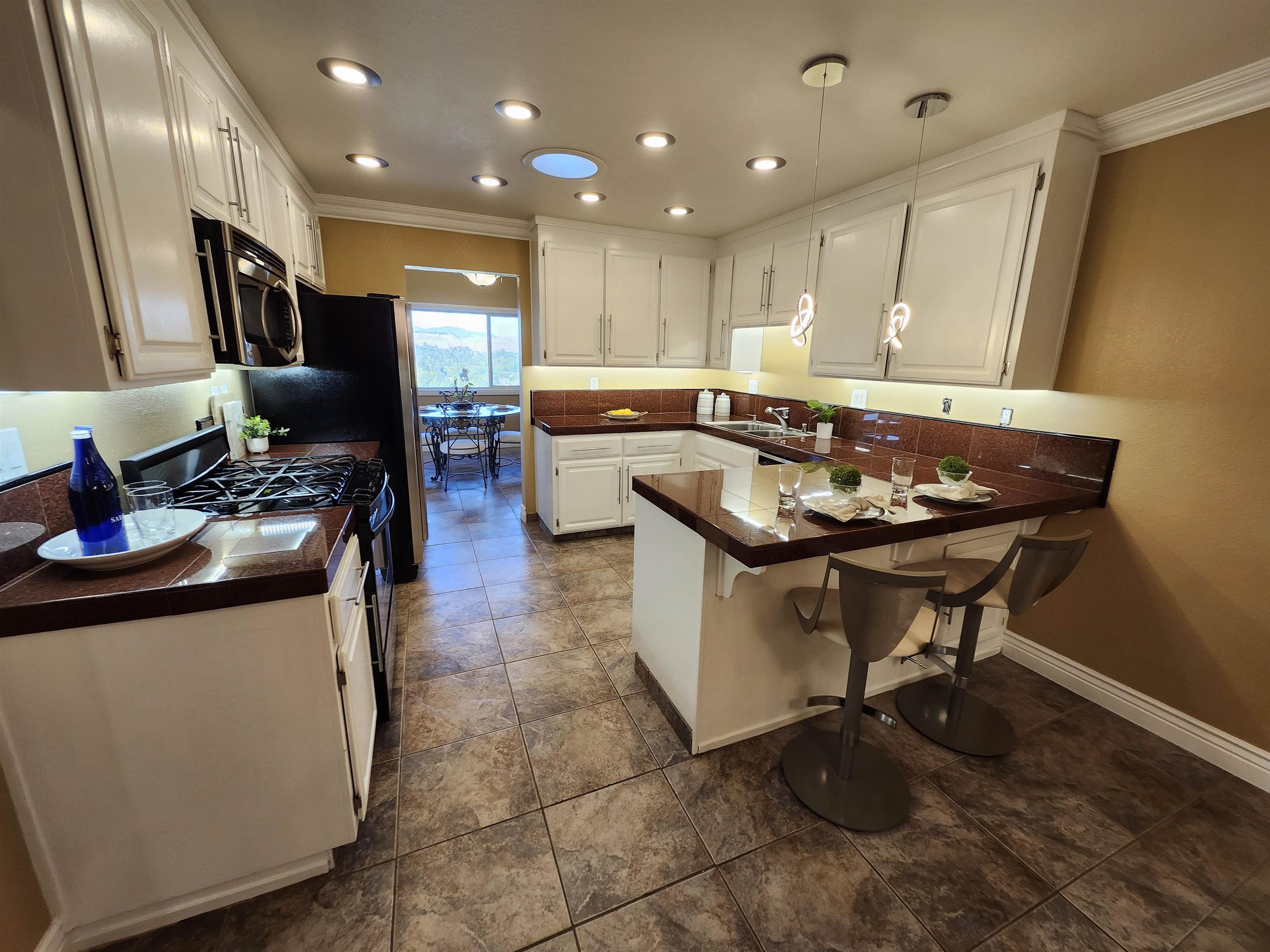 1823 Mockingbird Place Danville, CA 94526 - Photo 12 of 60 a kitchen with stainless steel appliances granite countertop a sink a stove and a wooden floors