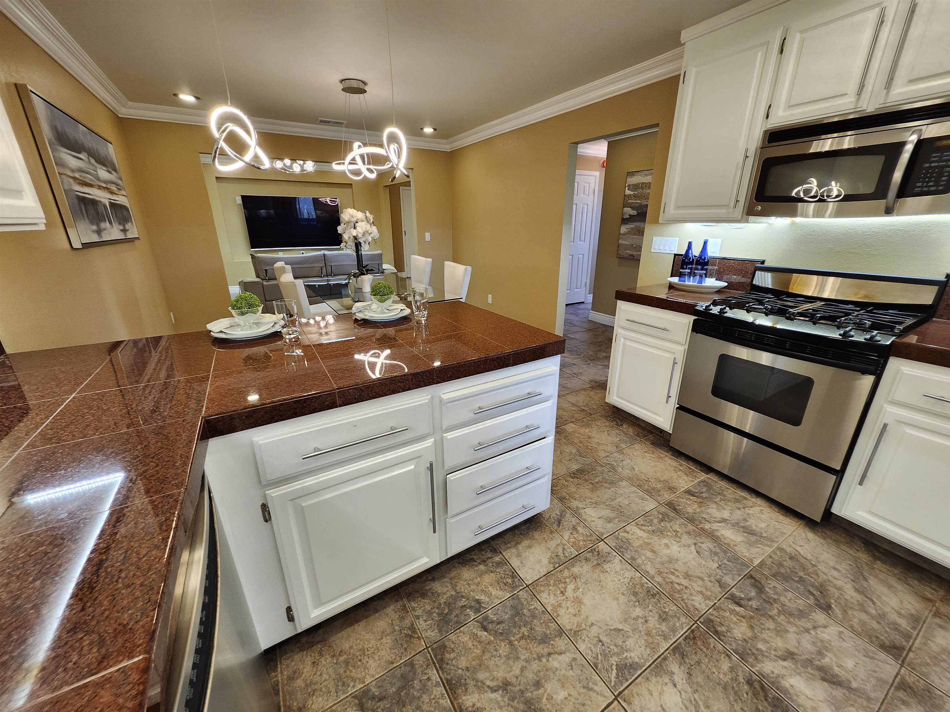 1823 Mockingbird Place Danville, CA 94526 - Photo 13 of 60 a kitchen with kitchen island granite countertop a stove and a sink