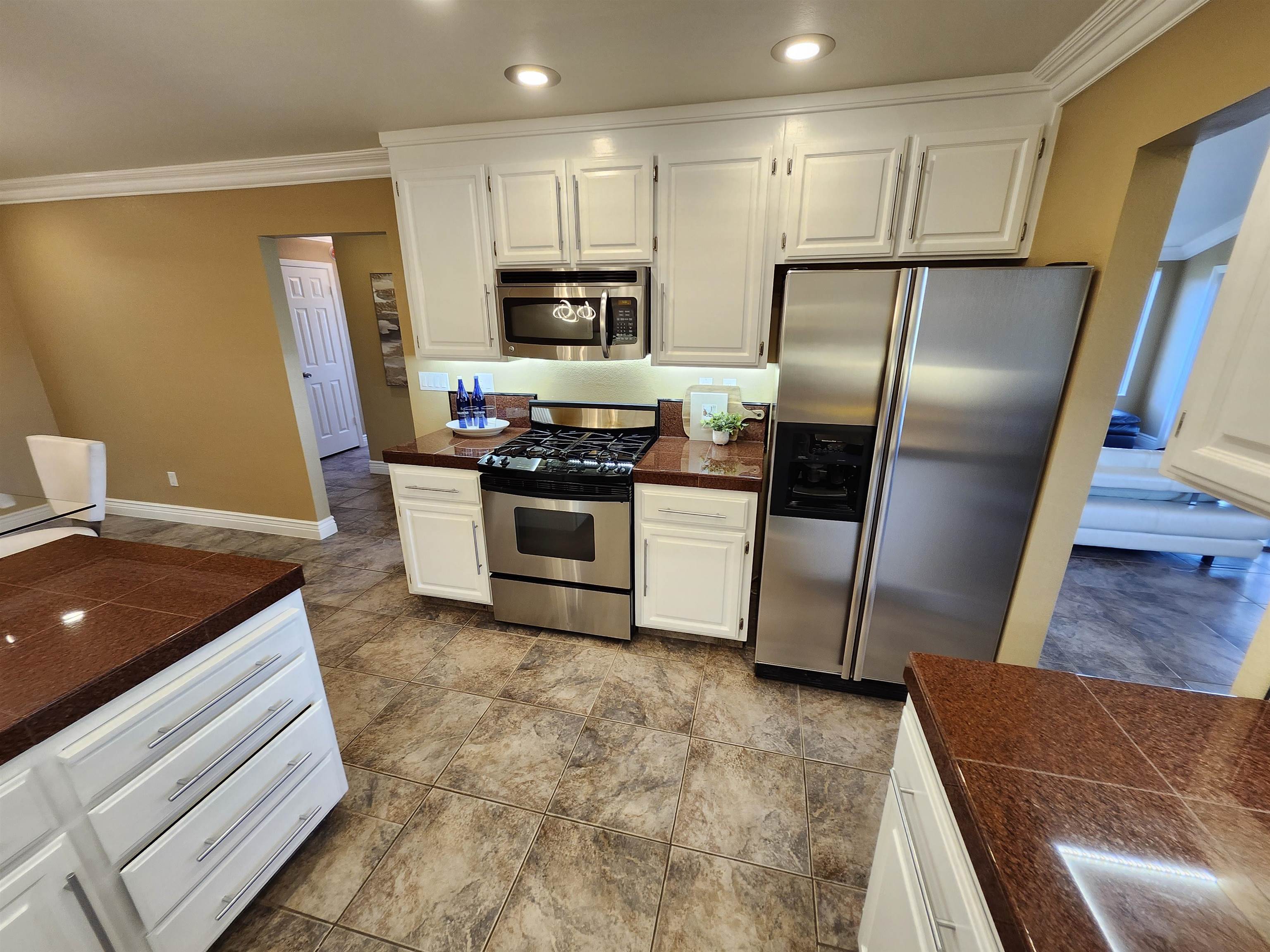1823 Mockingbird Place Danville, CA 94526 - Photo 14 of 60 a kitchen with stainless steel appliances granite countertop a refrigerator a stove and a sink