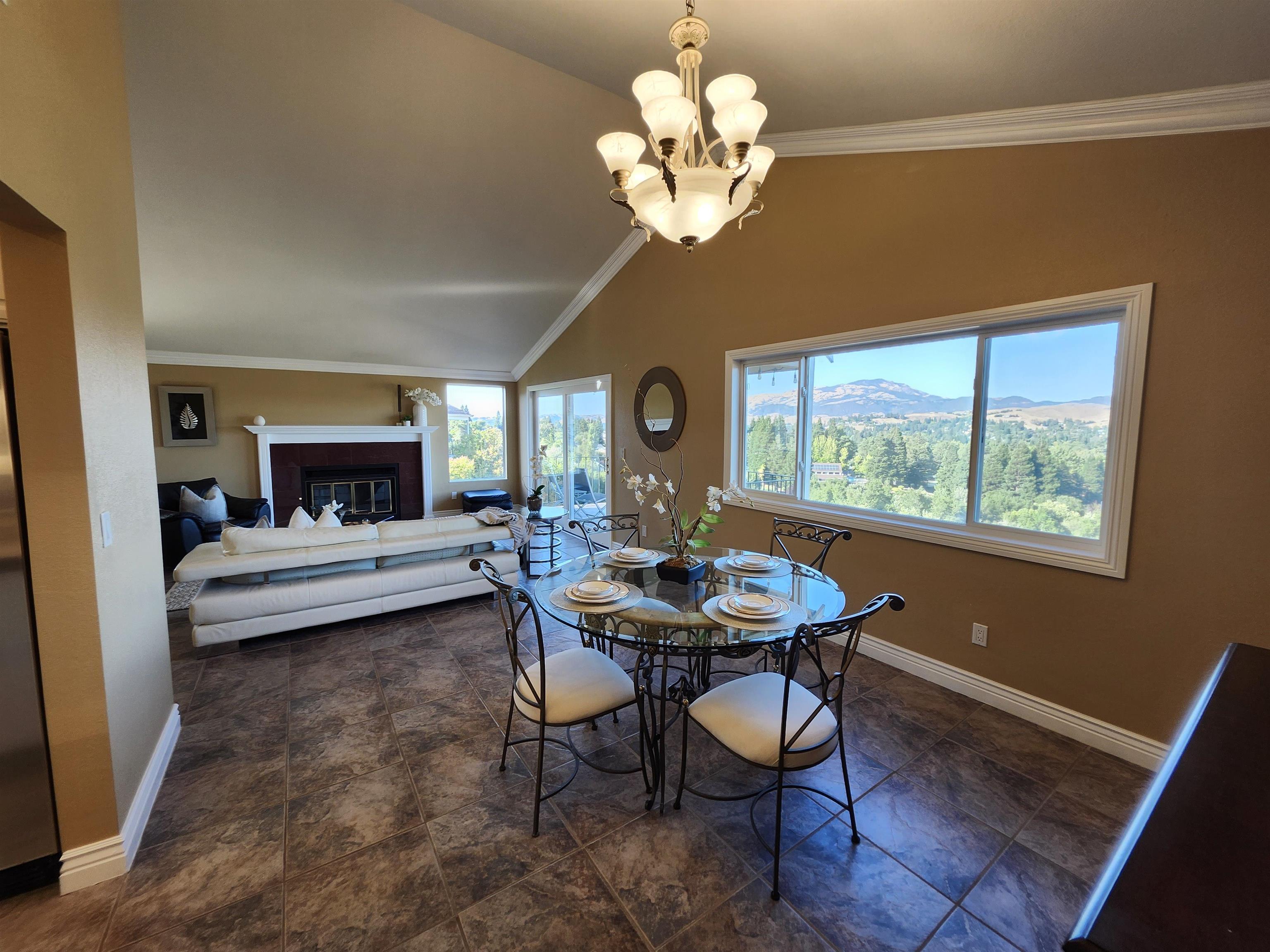 1823 Mockingbird Place Danville, CA 94526 - Photo 27 of 60 a view of a dining room with furniture a chandelier and wooden floor
