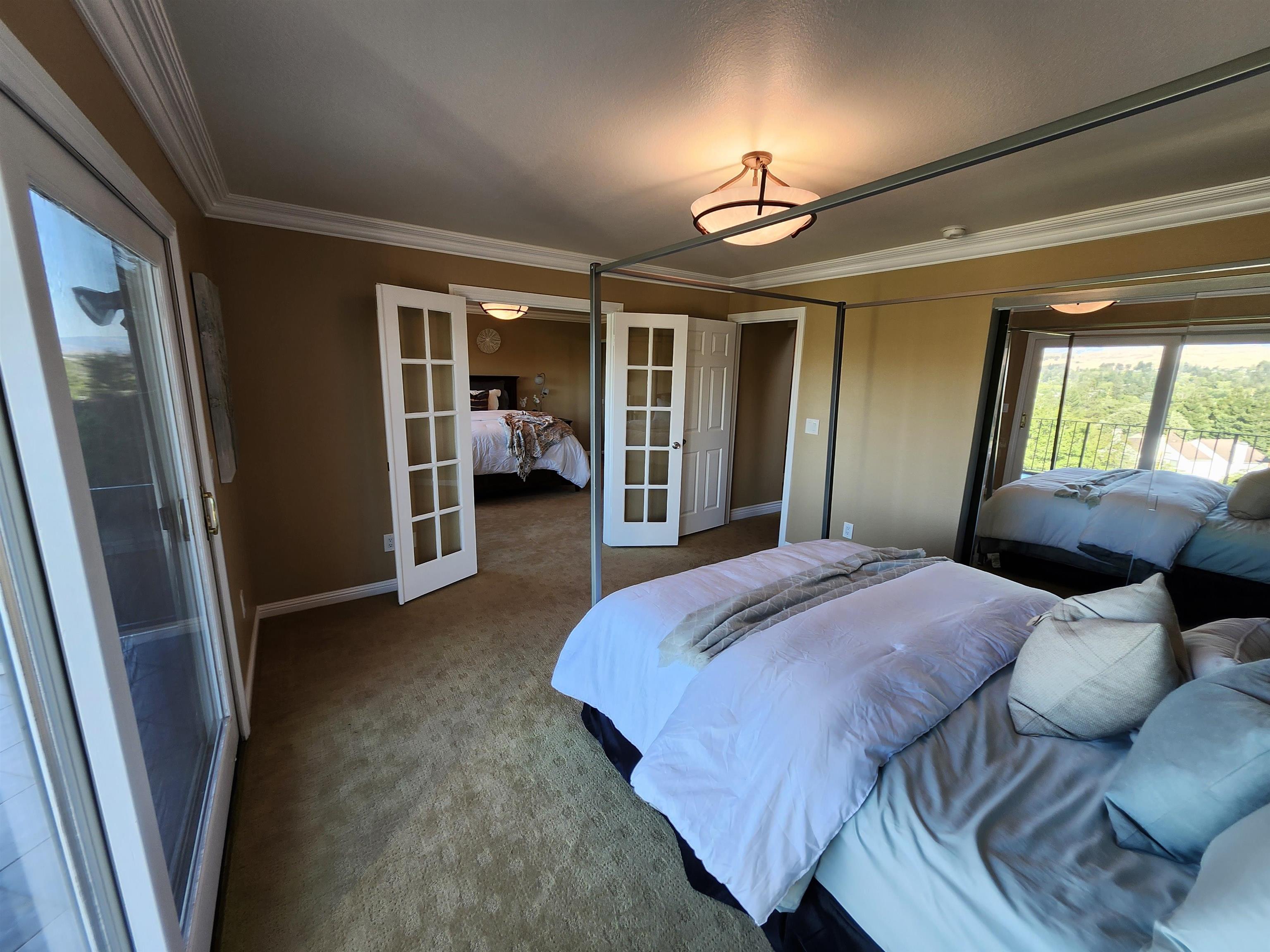 1823 Mockingbird Place Danville, CA 94526 - Photo 36 of 60 a bedroom with a bed and glass door