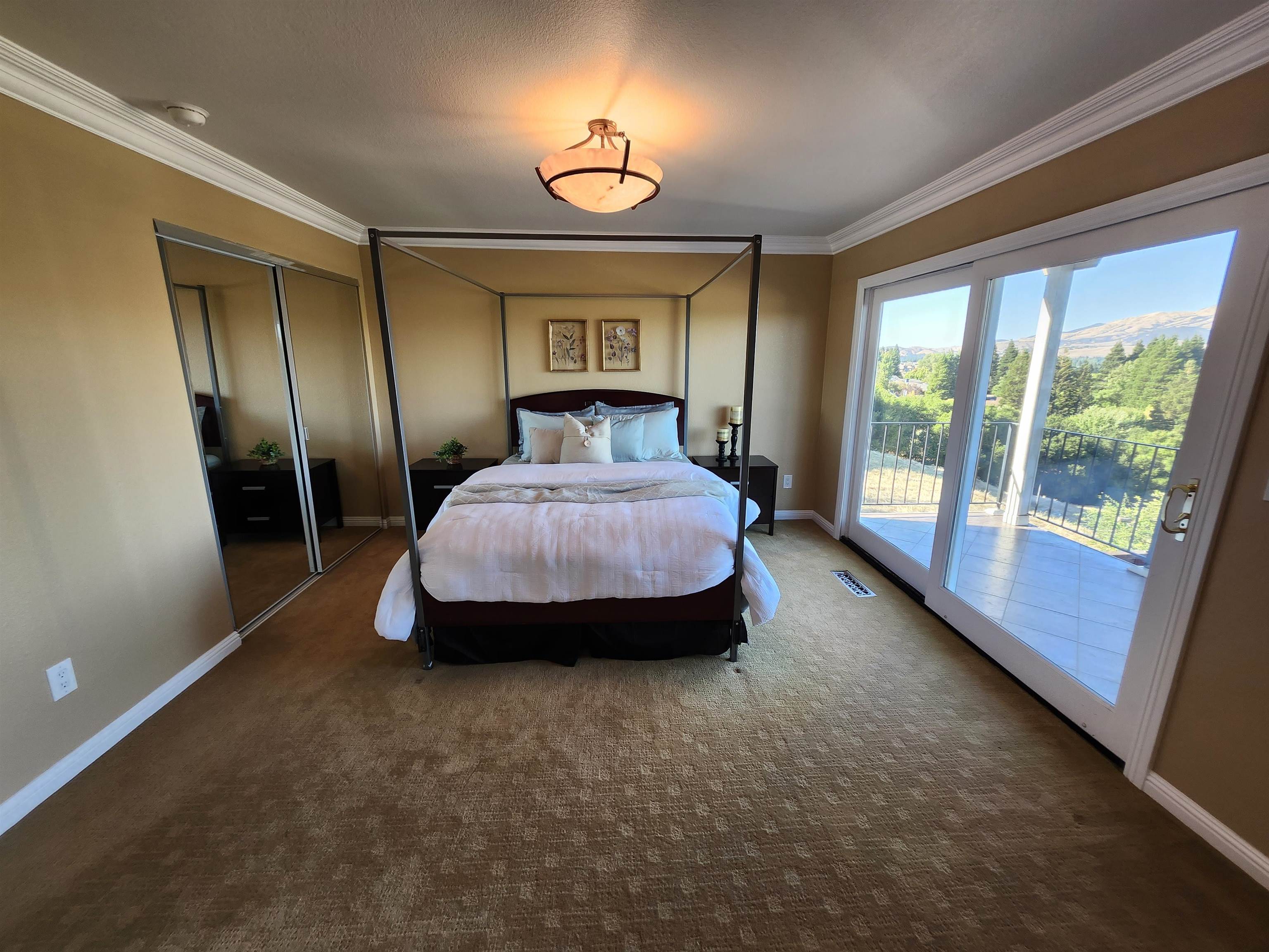 1823 Mockingbird Place Danville, CA 94526 - Photo 43 of 60 a spacious bedroom with a bed and a large window