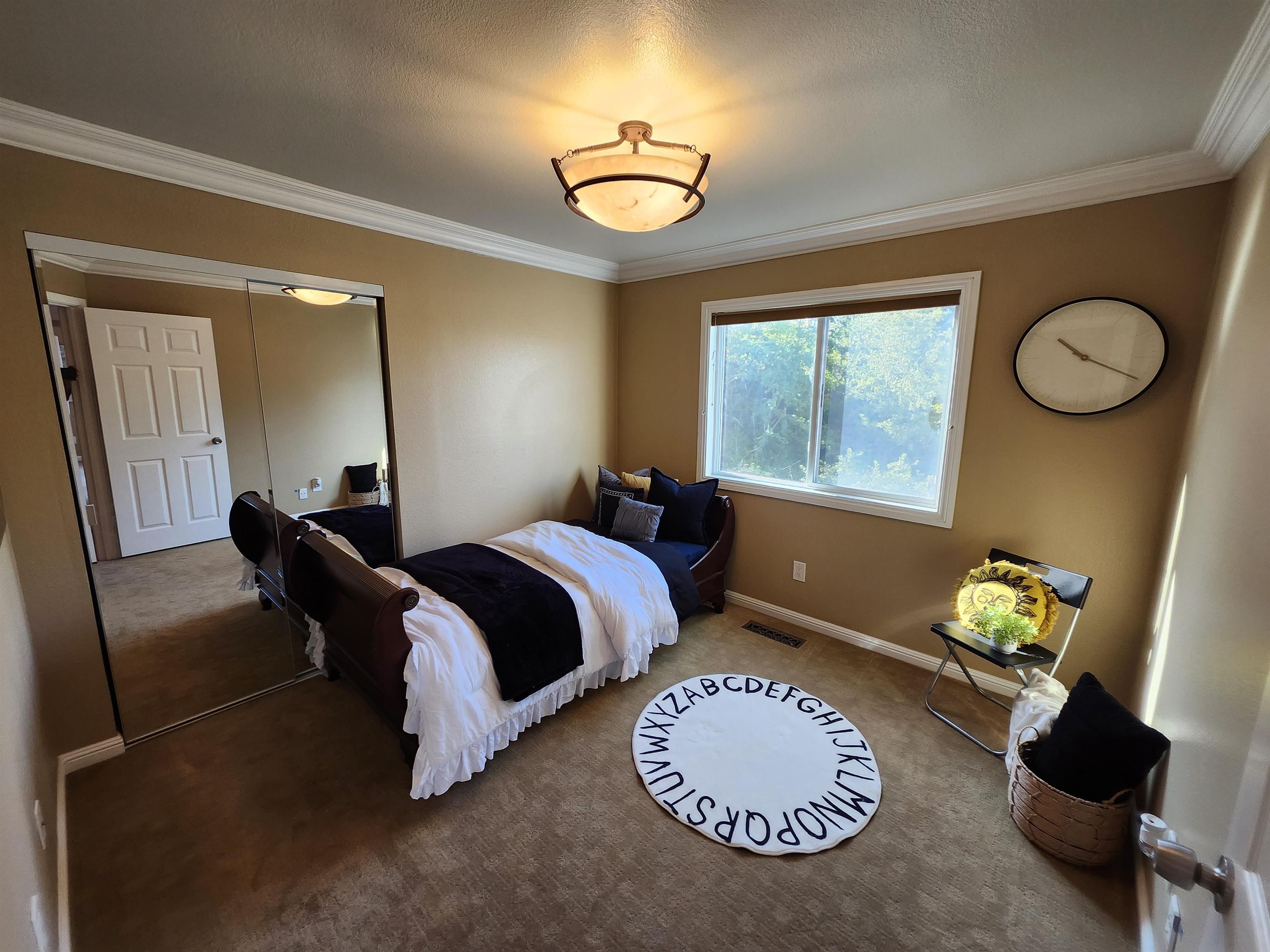 1823 Mockingbird Place Danville, CA 94526 - Photo 48 of 60 a bedroom with bed and a chandelier