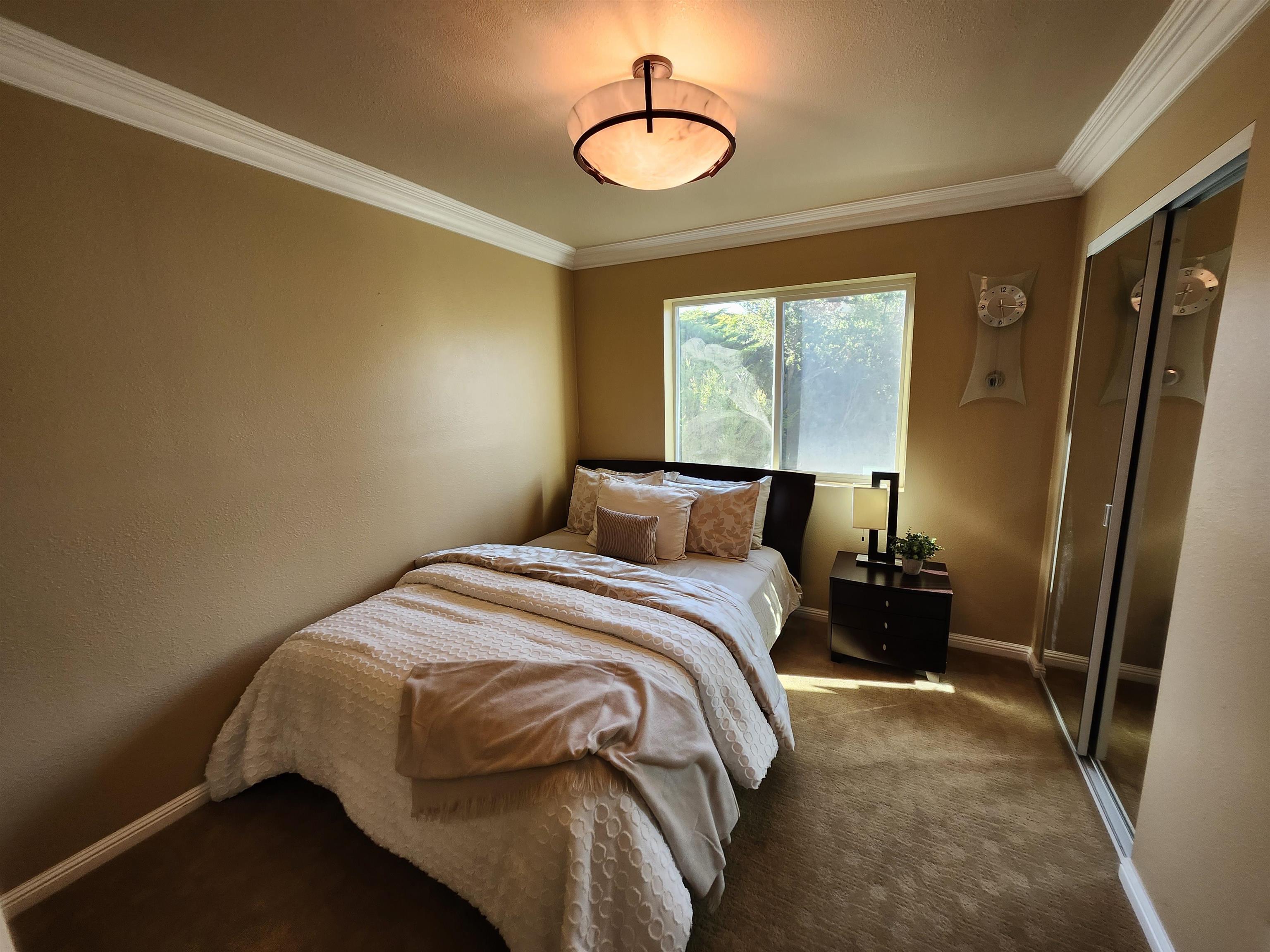 1823 Mockingbird Place Danville, CA 94526 - Photo 49 of 60 a bedroom with a bed and a mirror