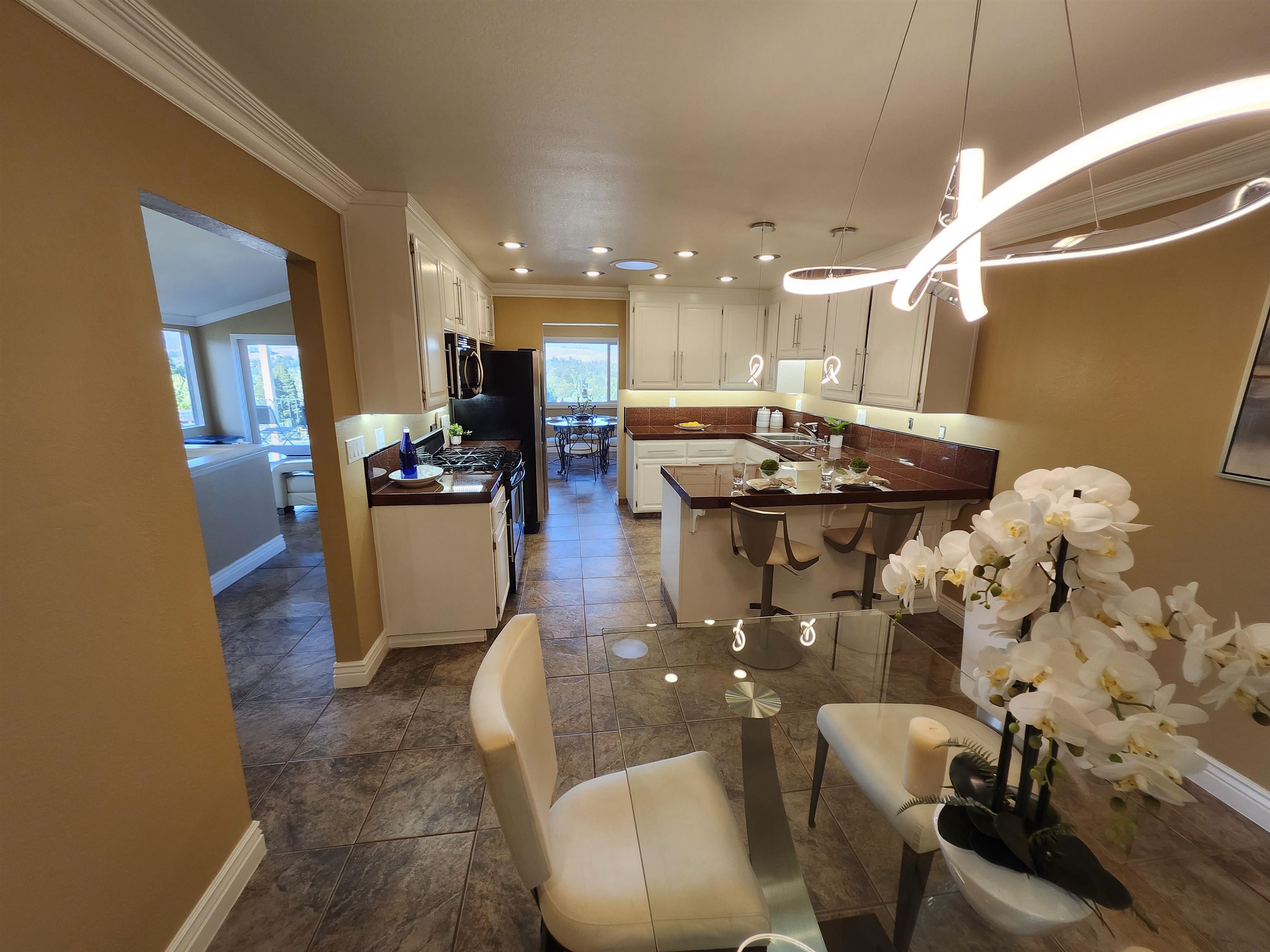 1823 Mockingbird Place Danville, CA 94526 - Photo 10 of 60 a kitchen with stainless steel appliances kitchen island granite countertop a sink and cabinets
