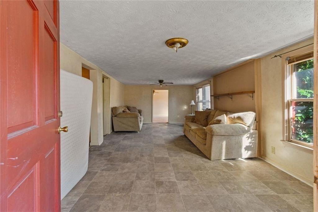 7315 Freeman Road Dawsonville, GA 30534 - Photo 15 of 28 a living room with furniture and a window