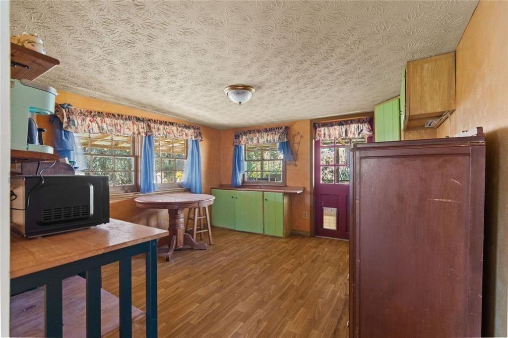 7315 Freeman Road Dawsonville, GA 30534 - Photo 18 of 28 a view of a livingroom with furniture and windows