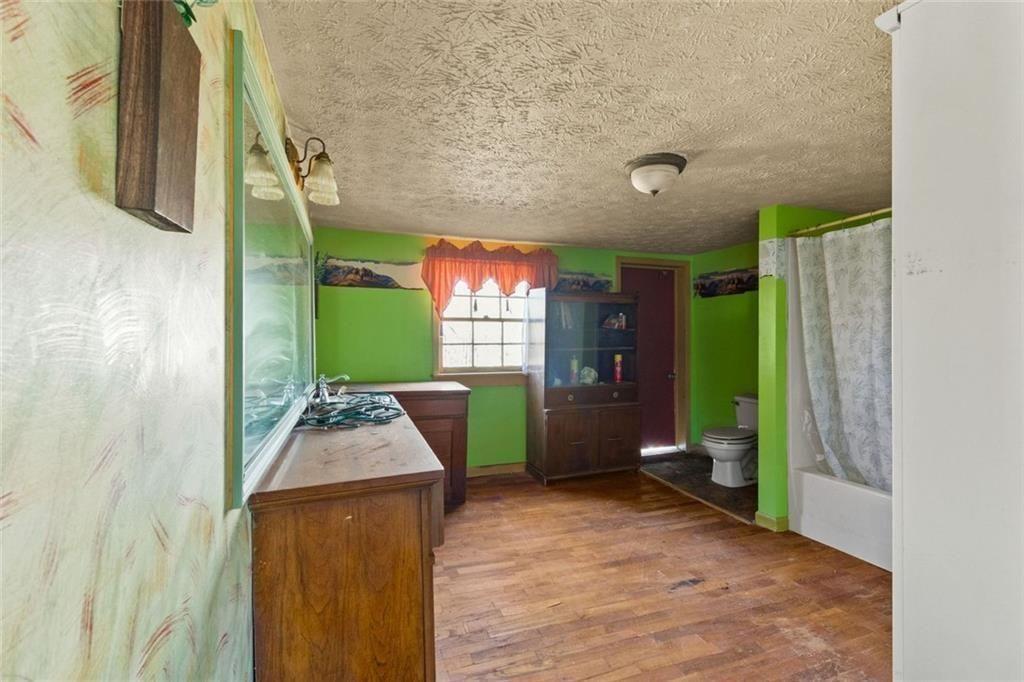 7315 Freeman Road Dawsonville, GA 30534 - Photo 21 of 28 a living room with furniture and a fireplace