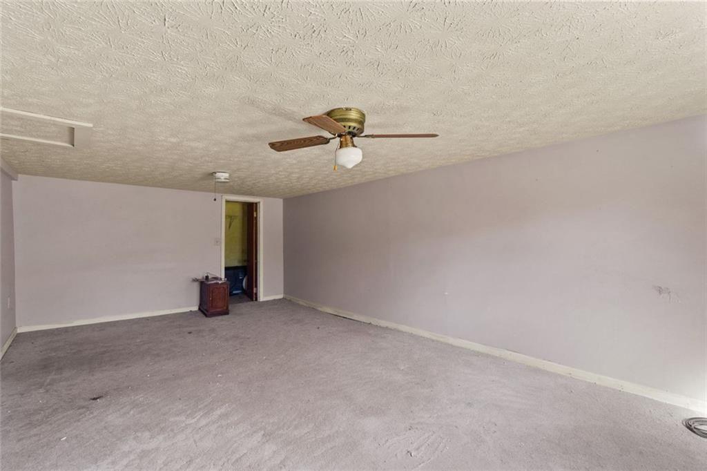 7315 Freeman Road Dawsonville, GA 30534 - Photo 25 of 28 an empty room with closet and windows