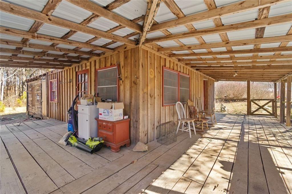 7315 Freeman Road Dawsonville, GA 30534 - Photo 27 of 28 a view of a porch with wooden chairs
