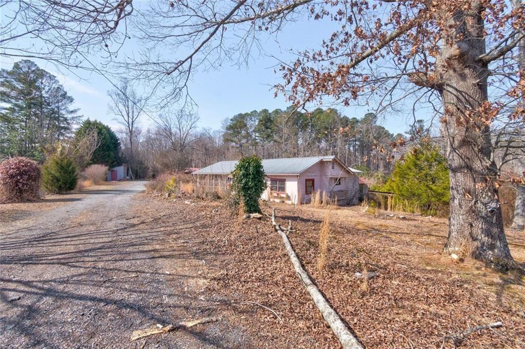 7315 Freeman Road Dawsonville, GA 30534 - Photo 9 of 28 a view of a house with a yard covered in snow