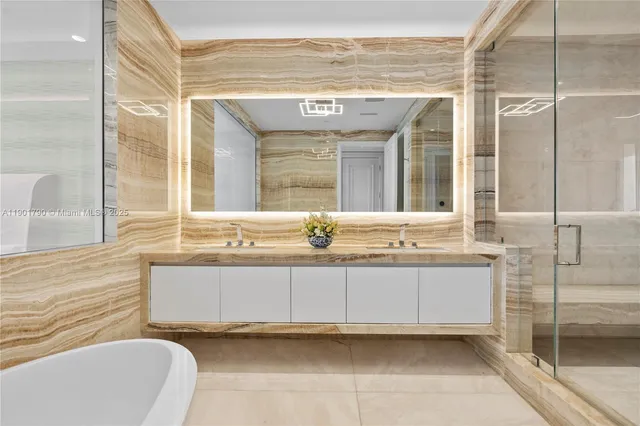 a bathroom with a tub sink and mirror