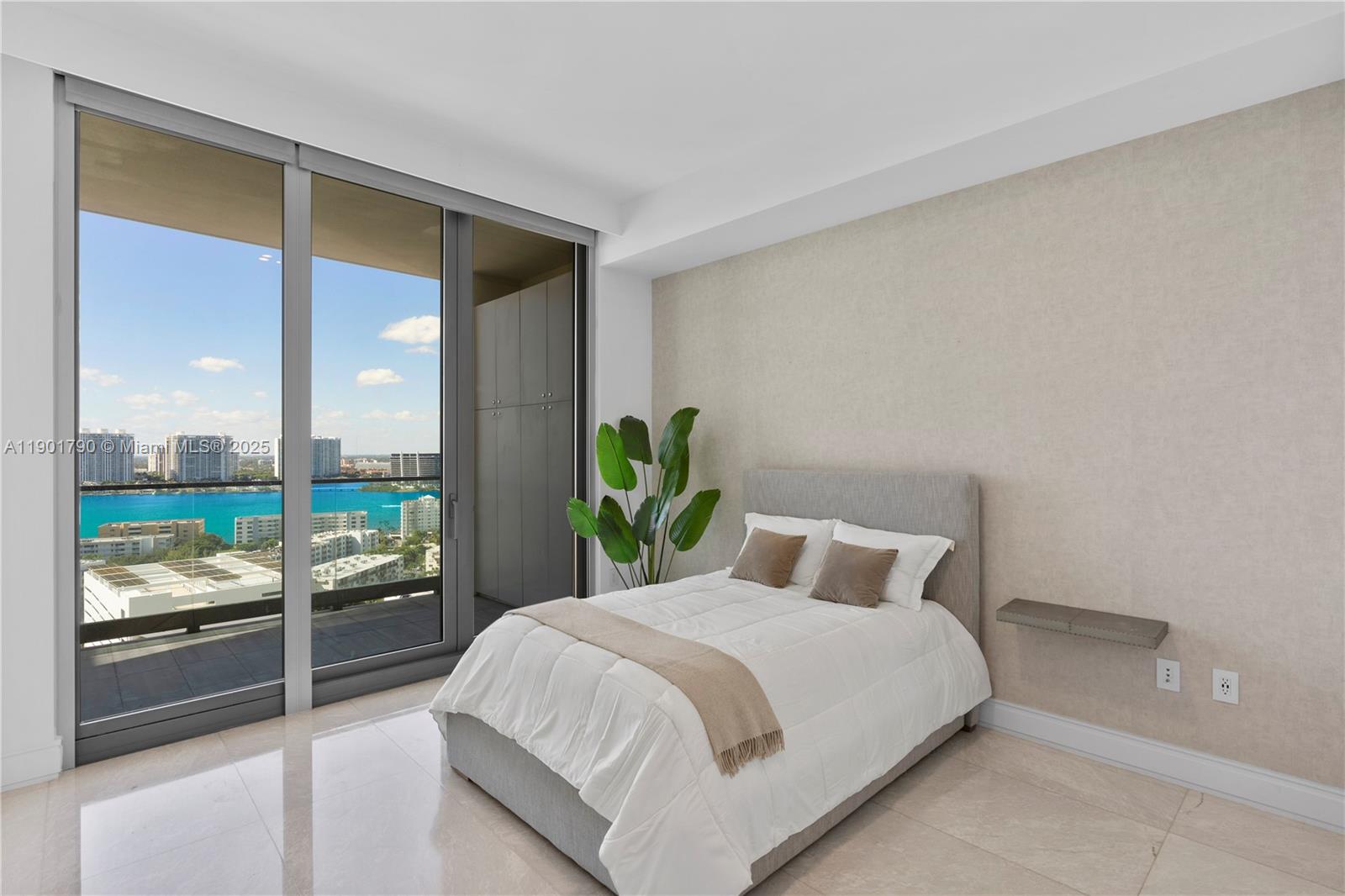 17901 Collins Avenue, Unit 1803 Sunny Isles Beach, FL 33160 - Photo 18 of 57 a bedroom with a bed and large window