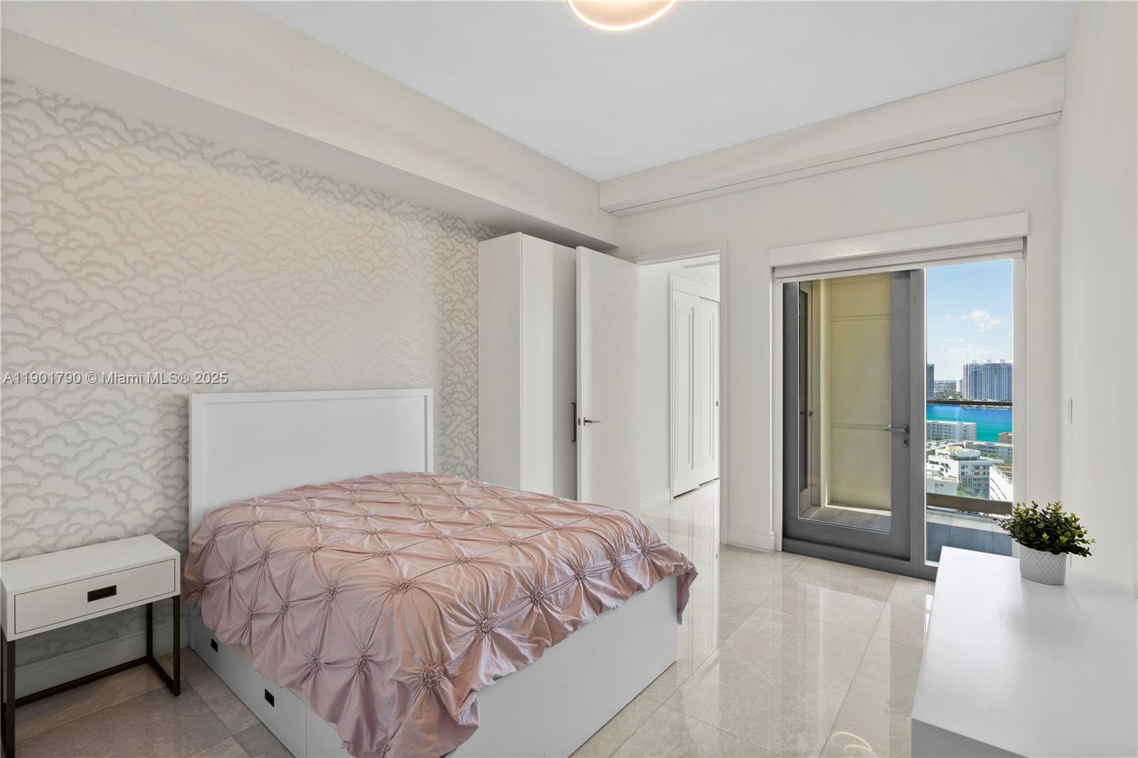 17901 Collins Avenue, Unit 1803 Sunny Isles Beach, FL 33160 - Photo 21 of 57 a bedroom with a bed and with view of bathroom