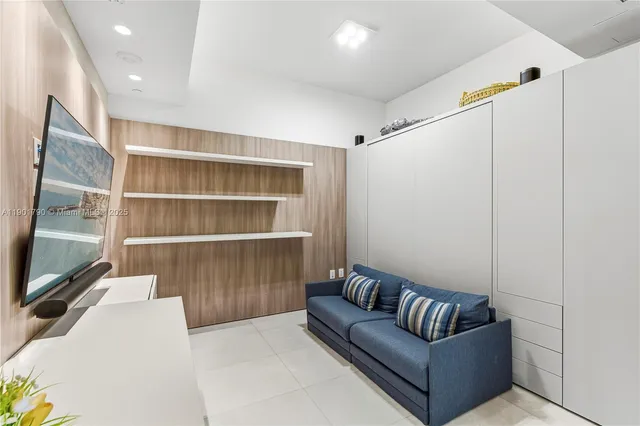 a living room with a couch and a flat screen tv